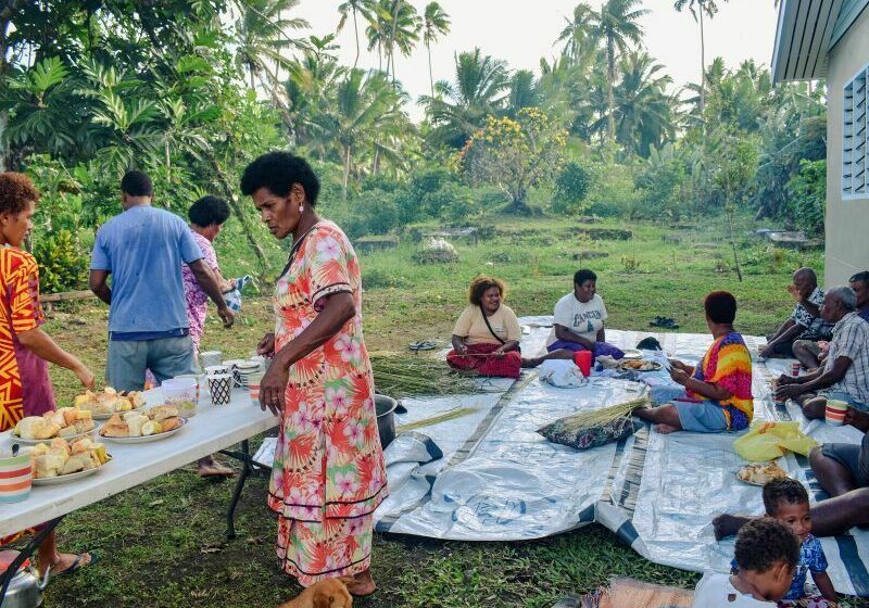A village community enjoying a meal together