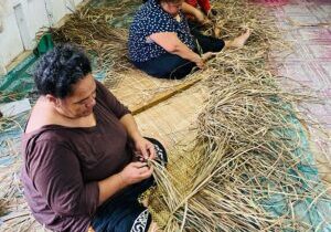 Women weaving pandanus leaves