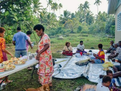 A village community enjoying a meal together