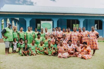 A group of 40 women, all workshop participants, standing together