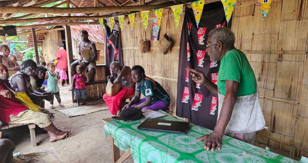 A man teaching others during an IKLP workshop