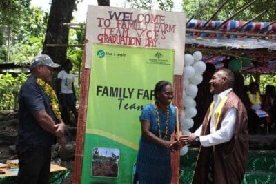 Presenting a graduate with a certificate at their graduation ceremony